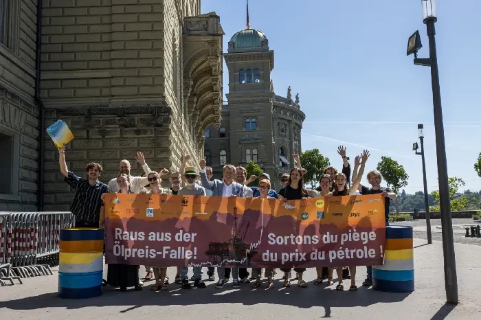 Climate Grandparents rally in front of a historic building